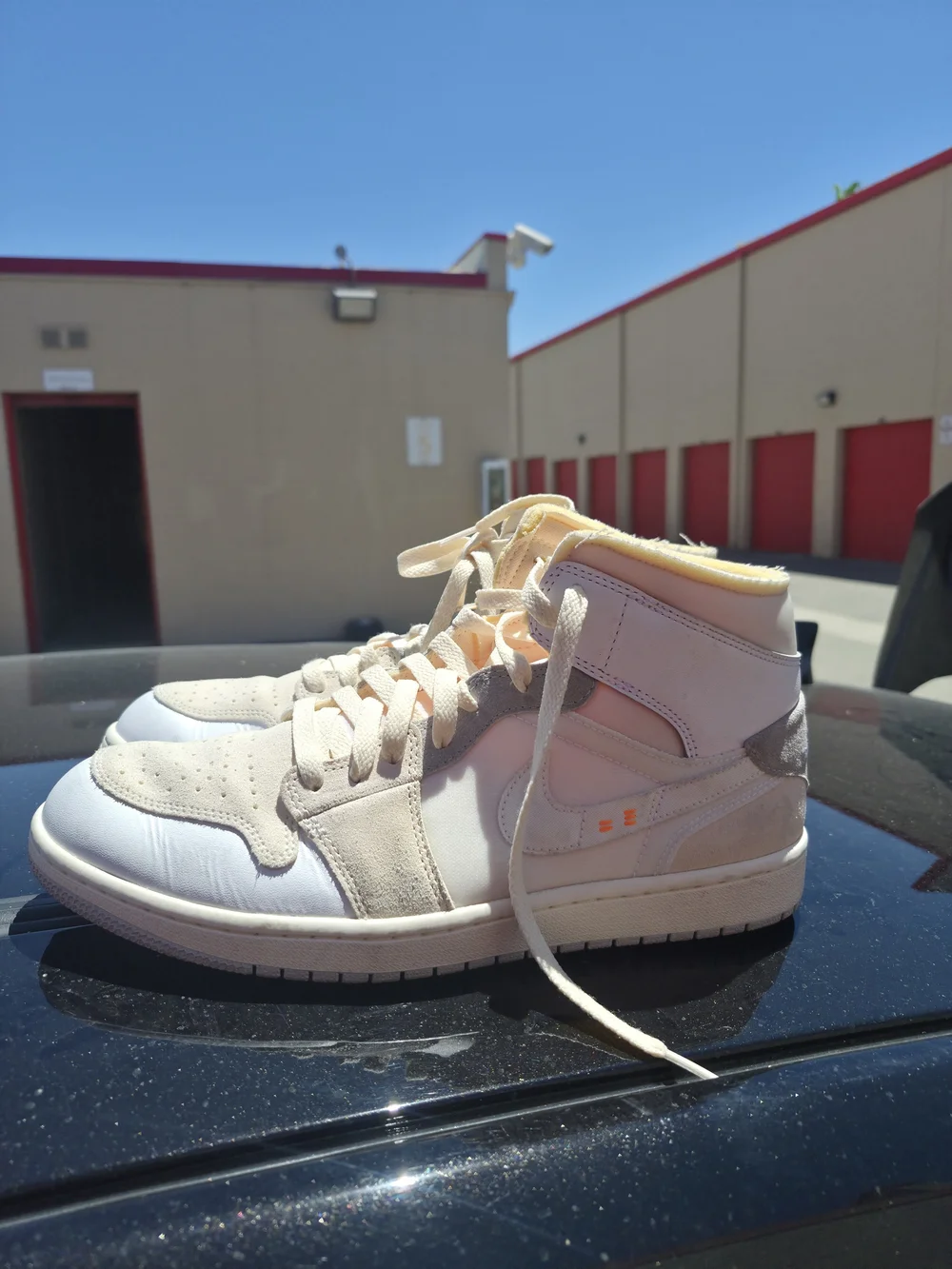 Jordan Men's 1 Mid Top Sneakers in Cream and White